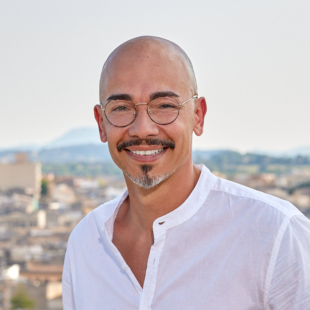 Portrait of Luca Tina, brand and graphic designer specializing in branding, print and web design.